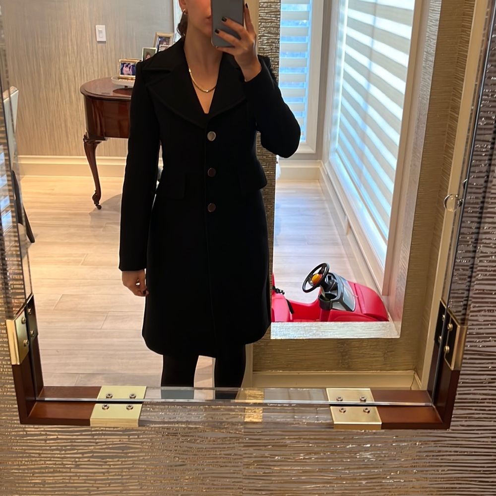 Luxurious and formal coat with gold buttons and collar